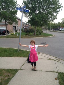 Abby posing at the bus stop