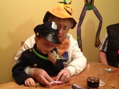 Mama helping Aiden dig into candy