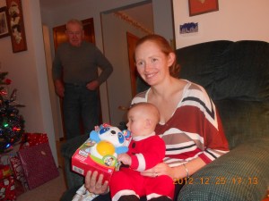 Julie with Macklan's new present while Uncle Joe looks on.