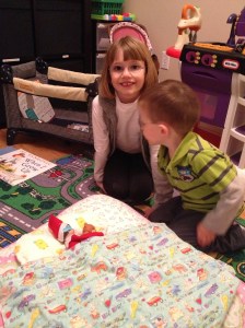 The kids looking over Blizzard while he takes a nap