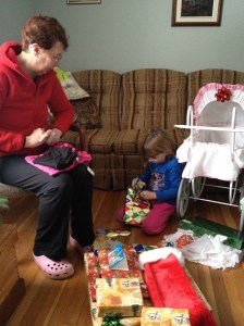 Abby with Grandma opening her presents.