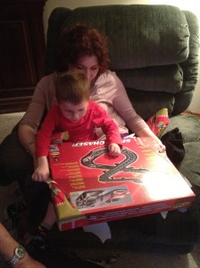 Melissa and Aiden inspecting his new racetrack.