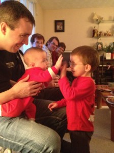 Aiden giving his cousin Macklan a high five.