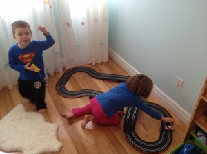 Aiden & Abby playing with Aiden's new racetrack.