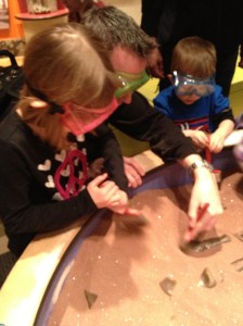 Abby & Aiden digging for dinosaur bones with Dad