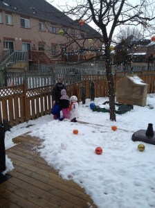 Dad, Abby & Aiden making their first snowman