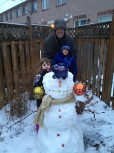 Abby, Aiden & Dad showing off their snowman (Check out those earrings)