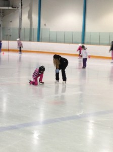 Abby getting some help from her teacher to get up