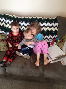 Abby giving her cousin Macklan a snuggle