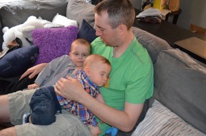 Macklan sleeping on me while Aiden looks on. This was Macklan's pre-church nap.