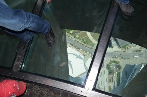 Aiden looking through the glass floor
