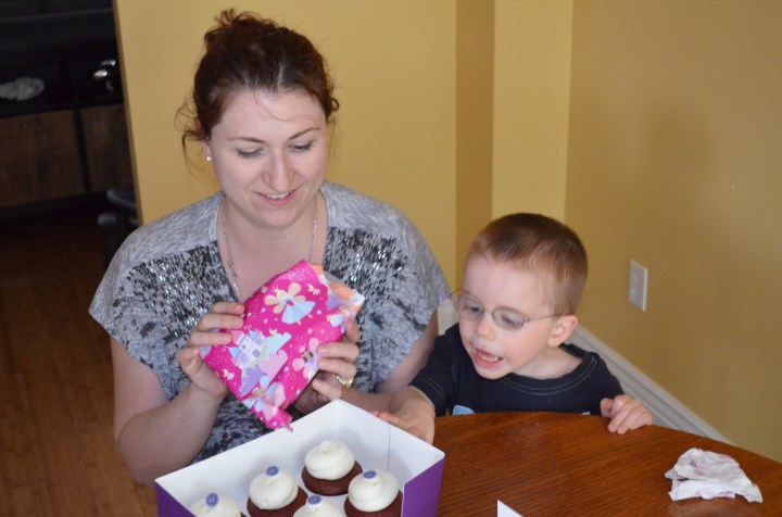 Melissa unwrapping her present from Abby