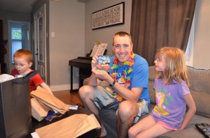 Peter holding up gift from Abby.