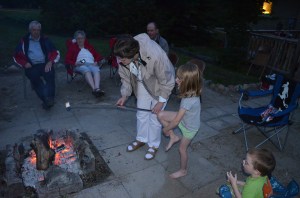 Jane helping Abby roast marshmallows