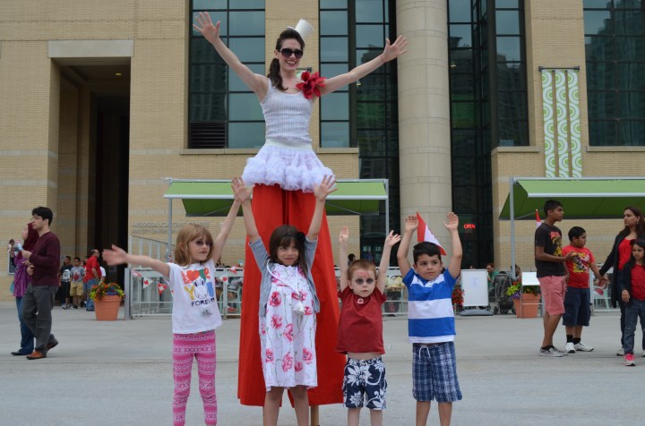 Abby, Serena, Aiden and AJ giving the hands up for the lady in stilts