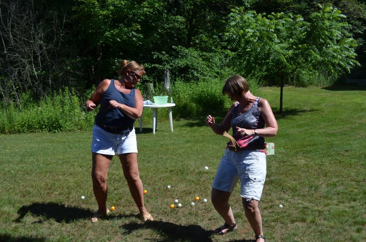 Sue and Carol playing ping pong game