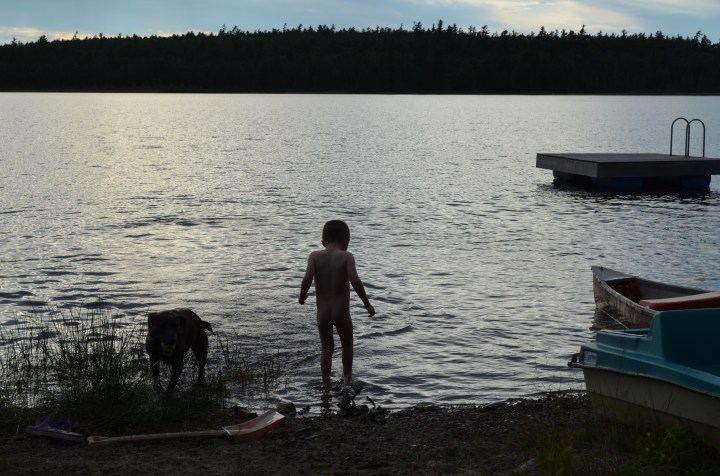 Aiden bathing in the water at sunset