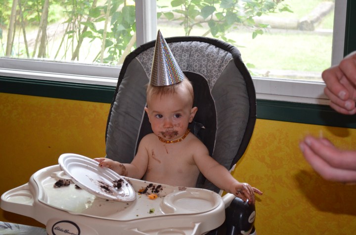 Enjoying his first chocolate cake