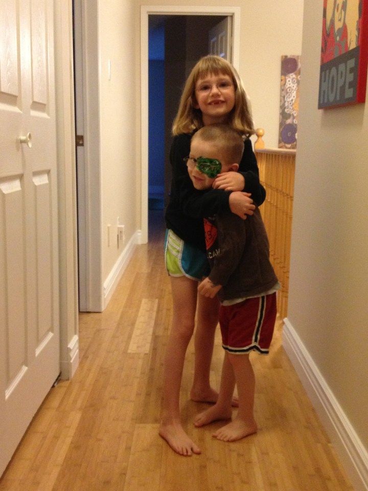 Abby hugging Aiden on the morning of her birthday