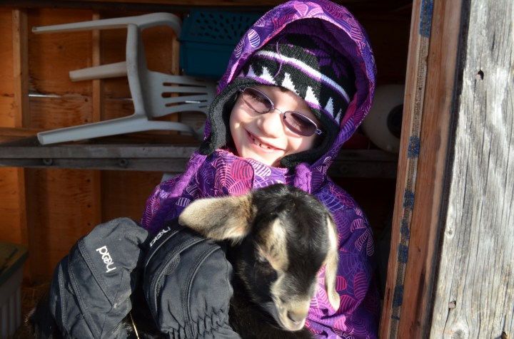 Abby holding a baby goat