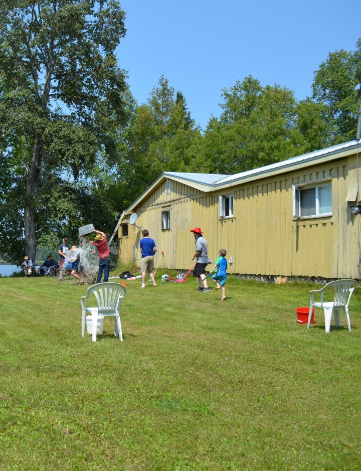 Phillip dumping the bucket at the end of the game onto Chantale and Stephanie