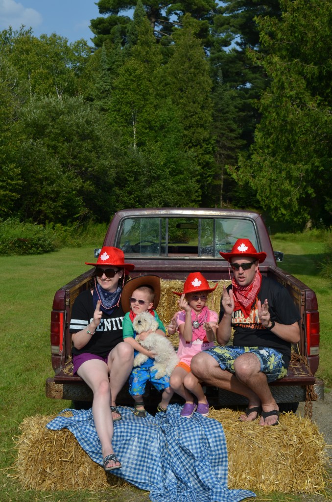 Family Portrait on the back of Philip's truck. Melissa, Aiden, Abby and Peter with the Gagne's dog shooting up the saloon :)