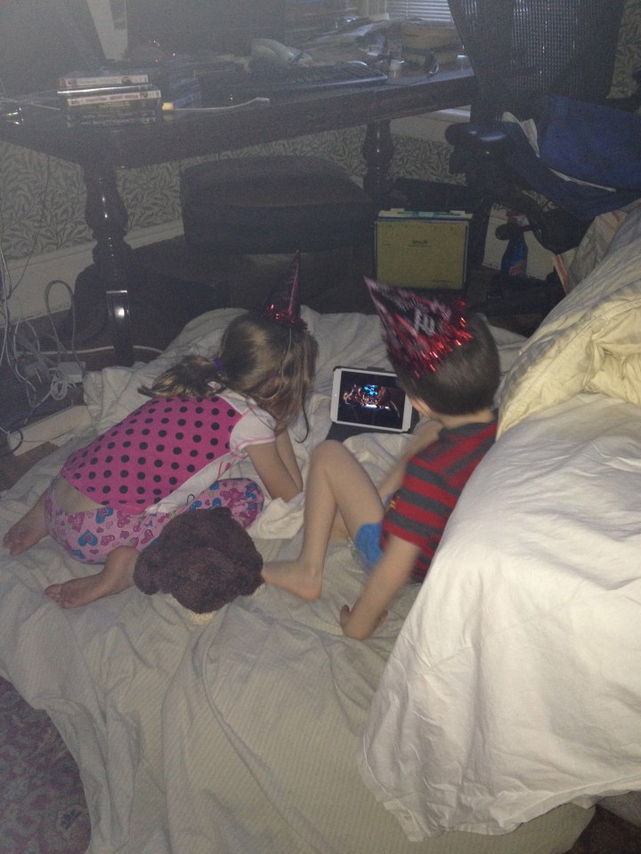 The kids watching a movie on New Year's Morning