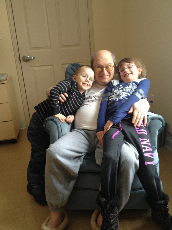 Aiden and Abby visiting with Grandpa.