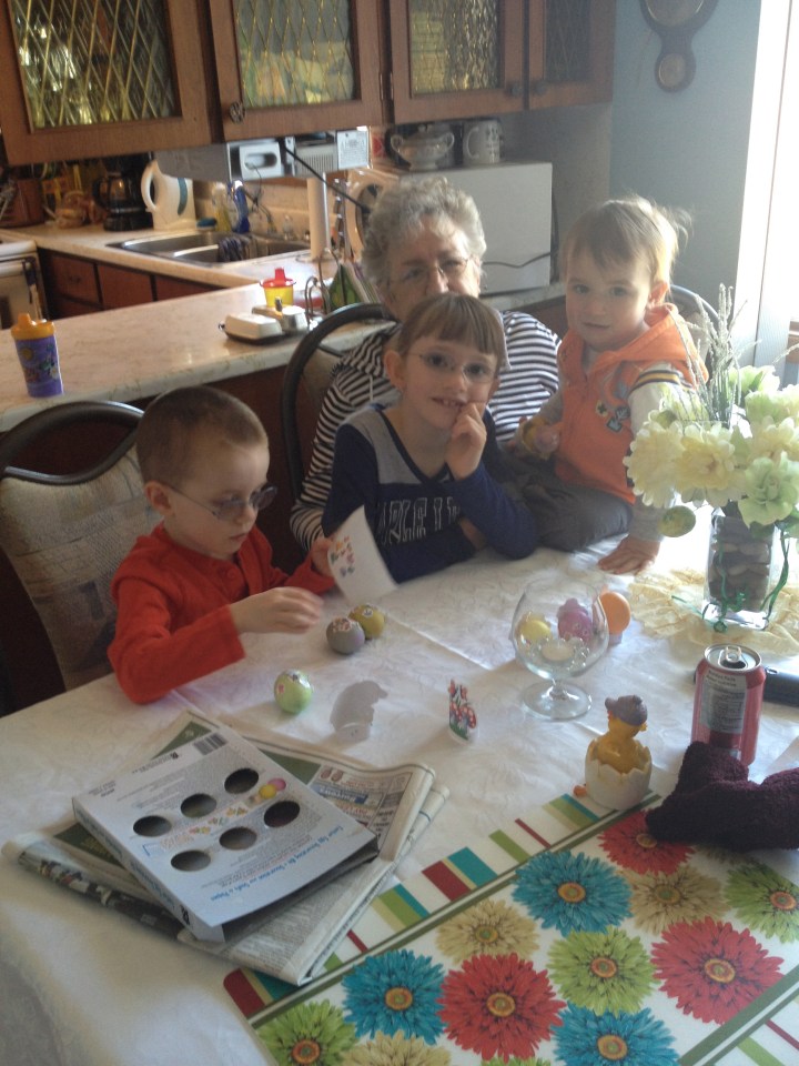 Aiden, Abby, Macklan with Mama painting eggs