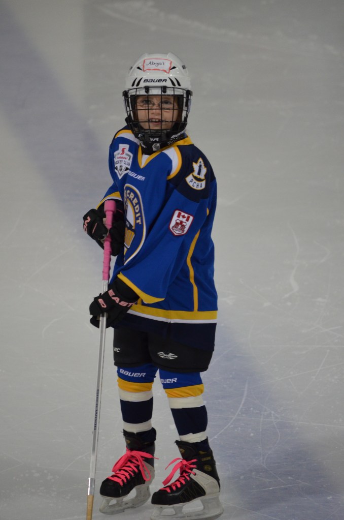 Abby playing a hockey game