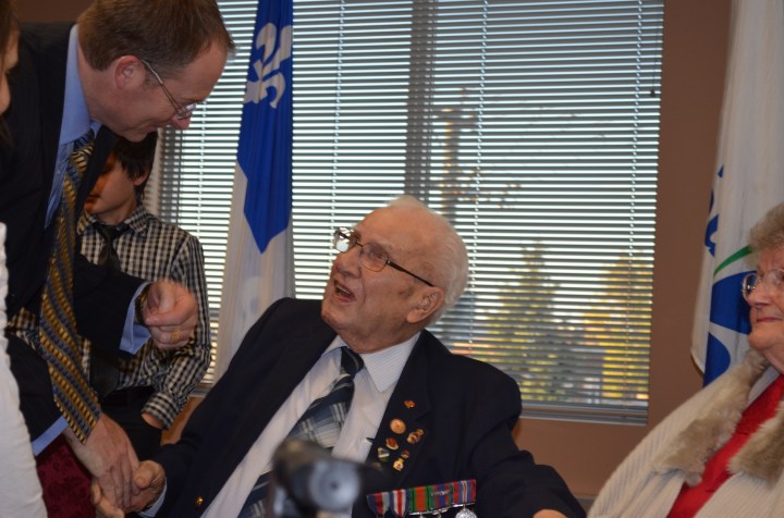 Uncle Gill shaking the hand of a dignitary at the ceremony.