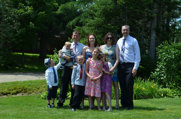 Back L-R: Martin holding Jasper, Hoily, Melissa and Peter Front L-R: Aiden, Colton, Sage and Abby Front Yard of Martin and Holly's