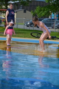 Sage playing with Ella at the Splash Pad.