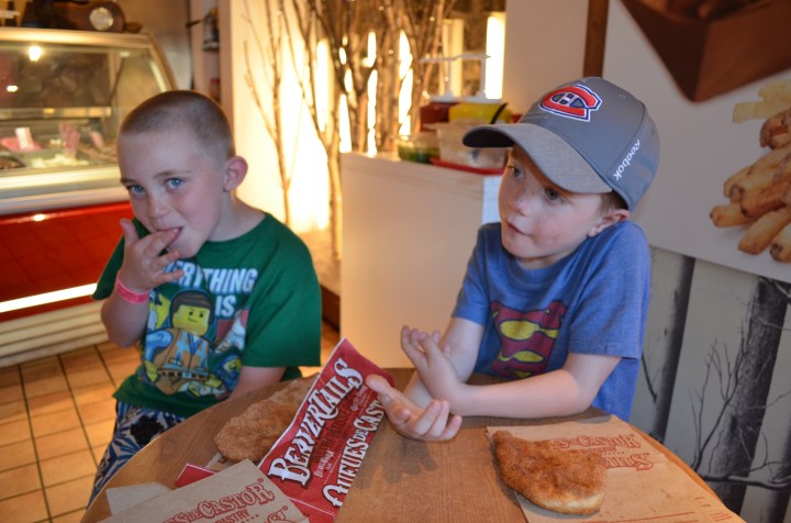 Colton and Aiden eating beavertails.