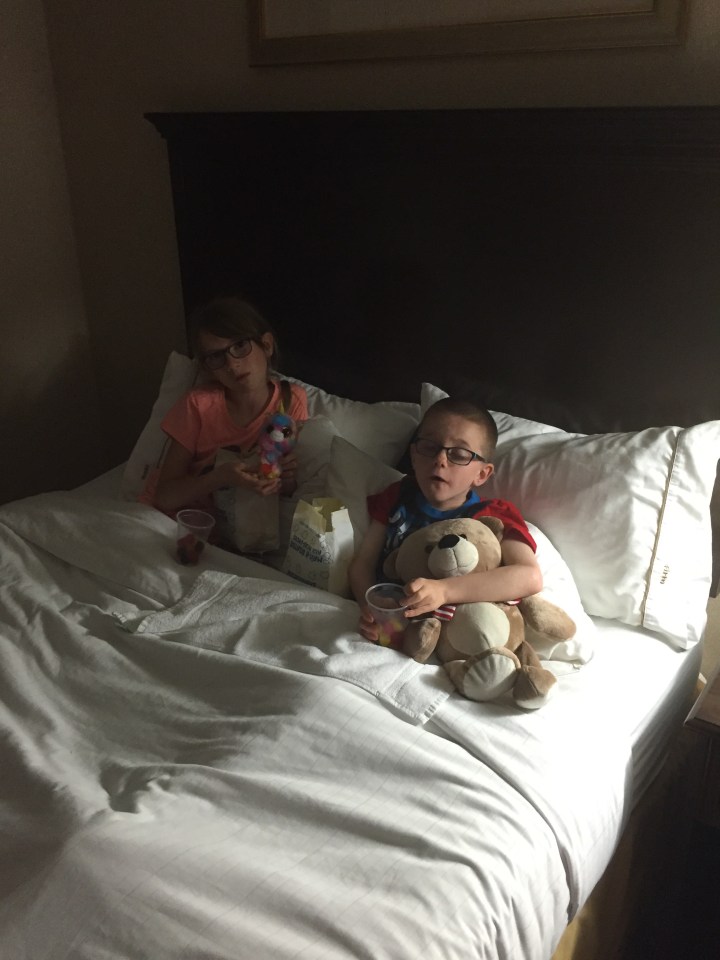 Aiden & Abby with treats in bed watching Star Wars